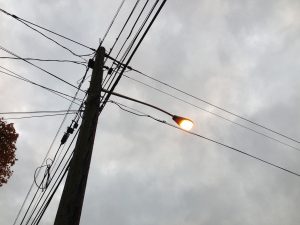 A high pressure sodium streetlight at dusk